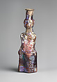 Glass bottle in the form of Tyche (Good Fortune), Glass, Roman