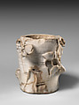 Marble cinerary urn in the form of a tree stump with leaves and grapes, Marble, Roman