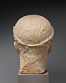 Limestone head of beardless male votary with wreath of leaves, Limestone, Cypriot