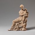 Terracotta statuette of a woman seated on a rock, Terracotta, Greek, South Italian