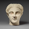 Limestone head of a wreathed youth, Limestone, Cypriot