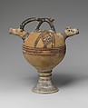 Terracotta vase on a high foot with two goats' heads in relief, Terracotta, Cypriot