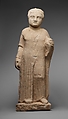 Limestone statue of a male votary holding a dove and an apple, Limestone, Cypriot