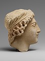 Limestone head of a wreathed youth, Limestone, Cypriot
