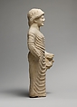 Limestone statue of a male votary holding a bird in the left hand, Limestone, Cypriot