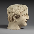 Limestone head of a wreathed youth, Limestone, Cypriot