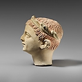Limestone head of a boy with a wreath of leaves, Limestone, Cypriot