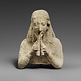 Upper part of a limestone statuette of a female aulos player, Limestone, Cypriot