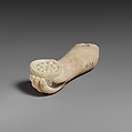 Limestone arm with pieces of fruit (?) held in the hand, Limestone, Cypriot