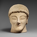 Limestone head of a beardless male votary with a wreath of rosettes, Limestone, Cypriot