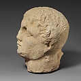 Limestone head of a beardless male votary, Limestone, Cypriot