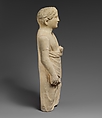 Limestone statuette of a boy holding a pyxis and a branch of leaves, Limestone, Cypriot