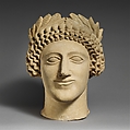 Limestone head of a youth with wreath, Limestone, Cypriot