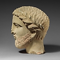 Limestone bearded head with a wreath of leaves, Limestone, Cypriot