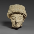 Limestone head with of a beardless male with a wreath of leaves, Limestone, Cypriot