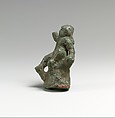 Bronze statuette of Eros seated on a rock, Bronze, Greek or Roman