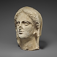 Limestone head of a veiled female votary, Limestone, Cypriot