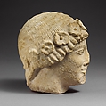 Limestone beardless male head with a wreath of rosettes, Limestone, Cypriot