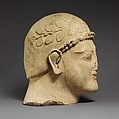 Head of a bearded male with a wreath of leaves, Limestone, Cypriot