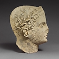 Limestone head of beardless male votary, Limestone, Cypriot