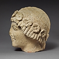 Limestone beardless male head with a wreath of rosettes, Limestone, Cypriot