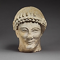 Limestone head of a beardless male with a wreath of flower buds, Limestone, Cypriot