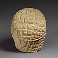 Limestone head of a bearded male with a wreath of leaves, Limestone, Cypriot