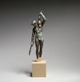 Bronze statuette of a satyr with a torch and wineskin, Bronze, Greek