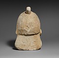 Limestone head of a bearded male wearing a conical helmet, Limestone, Cypriot