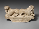 Limestone finial of a funerary stele with two recumbent lions, Limestone, Cypriot