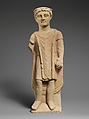 Limestone statuette of a boy holding a pyxis, Limestone, Cypriot