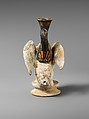 Terracotta lekythos (oil flask) in the form of a sphinx, Terracotta, Greek, Attic