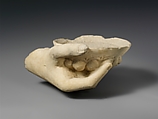 Limestone statue fragment of a right hand holding a phiale (libation bowl), Limestone, Cypriot