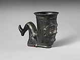 Terracotta vessel in the shape of a bent leg, Terracotta, Etruscan