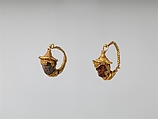 Gold and amber earrings with head of a Black African youth, Gold, amber, Etruscan