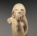 Limestone figure holding a mask, Limestone, Cypriot