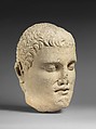 Limestone head of beardless male votary, Limestone, Cypriot