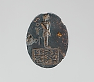 Haematite intaglio: Youth on inscribed stele, Haematite, Roman