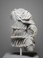 Limestone torso of a hunter, Black limestone, Roman