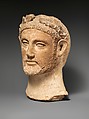 Terracotta head of a man wearing a wreath, Terracotta, Cypriot