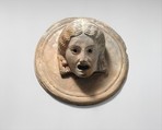 Two terracotta roundels with theatrical masks, Terracotta, Greek
