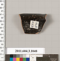 Terracotta fragment of a mastoid (drinking cup with narrow base), Terracotta, Greek, Attic