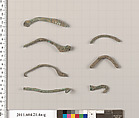 Fragments of fibulae (safety pins), Bronze