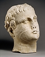 Limestone head of beardless male votary with wreath of leaves, Limestone, Cypriot