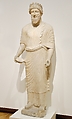 Limestone votary of a bearded male with a wreath, Limestone, Cypriot
