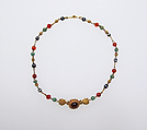 Gold, emerald, carnelian, banded onyx, and garnet necklace, Gold, emerald, carnelian, banded onyx, with central cabochon garnet, Roman