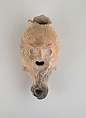 Terracotta lamp in the form of a grotesque head, Terracotta, East Greek, Lydian