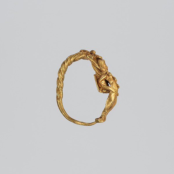Gold earring with winged figure (one of a pair)