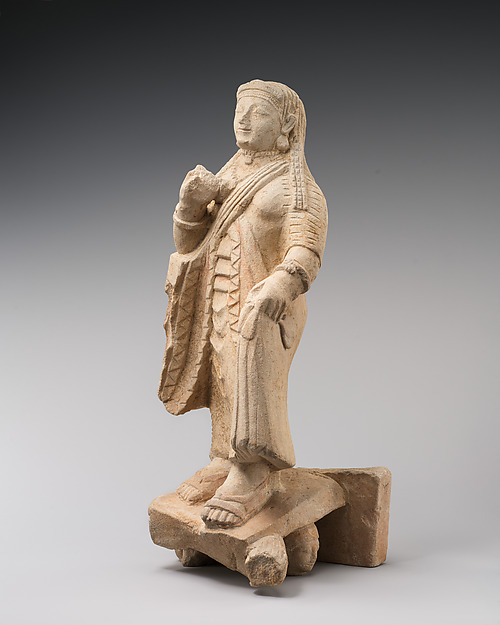 Limestone figure of a woman