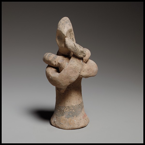 Standing male flute player with a serpent around his shoulders by an unrecorded maker, The Metropolitan Museum of Art